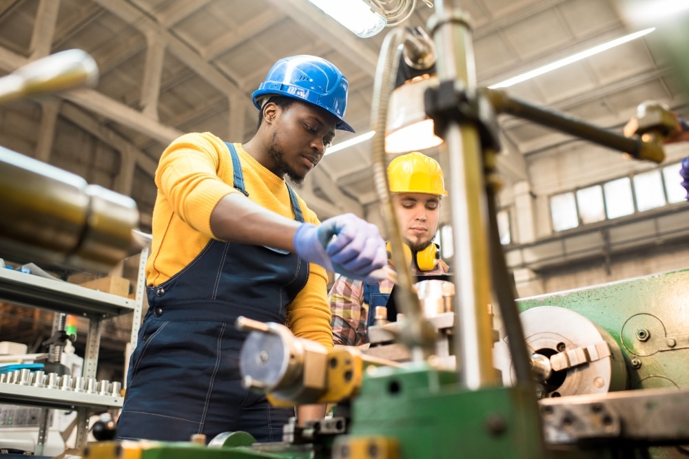 Men who use a digital workplace in manufacturing.